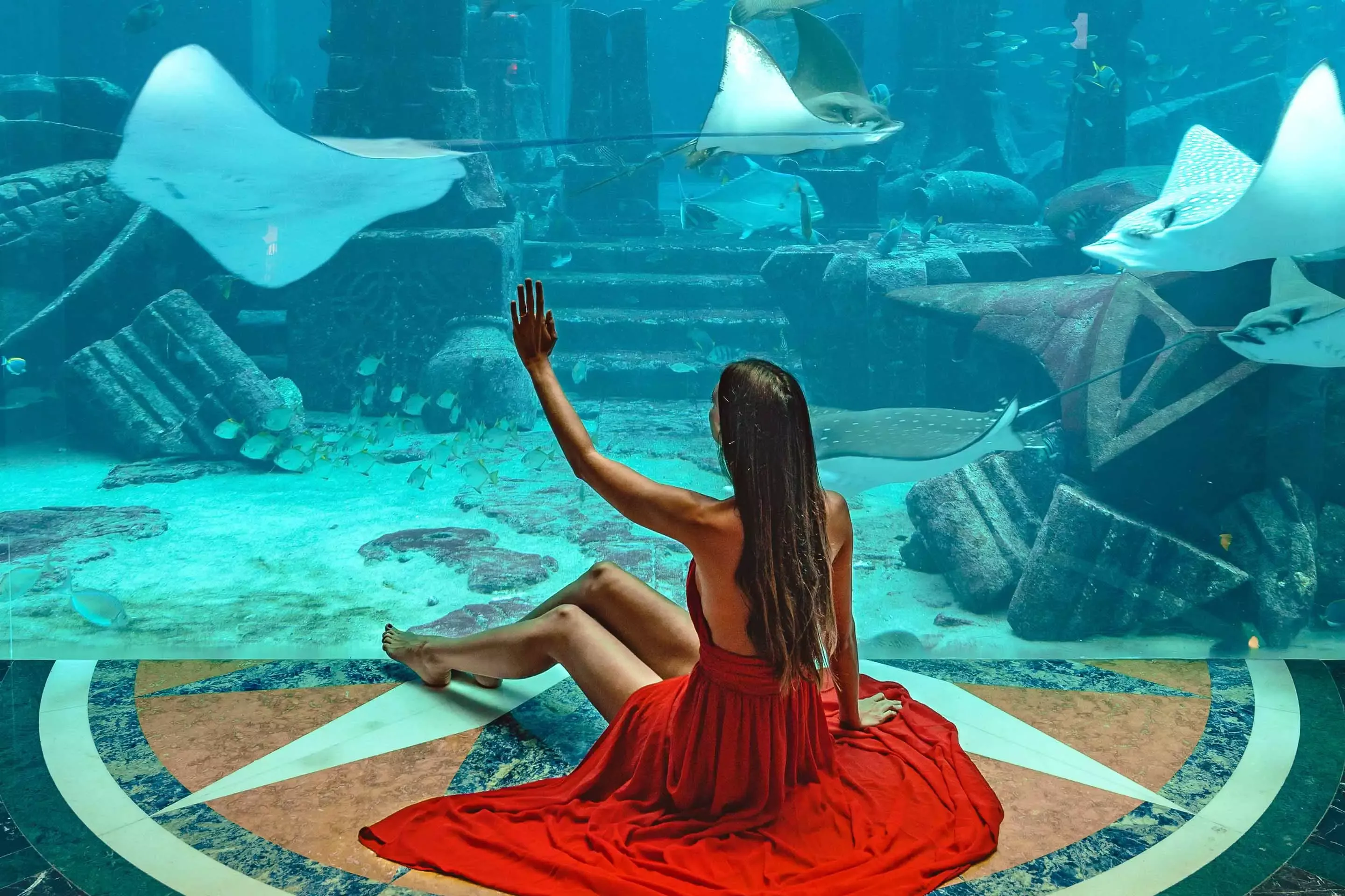 Lady in Red Dress in Ambassador Lagoon at Atlantis Dubai