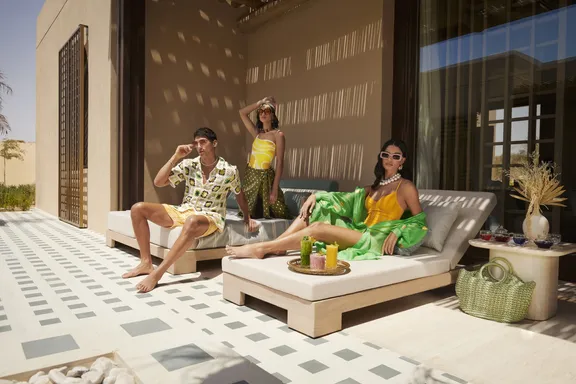 People sitting on sunbeds and enjoying at Bab Al Shams