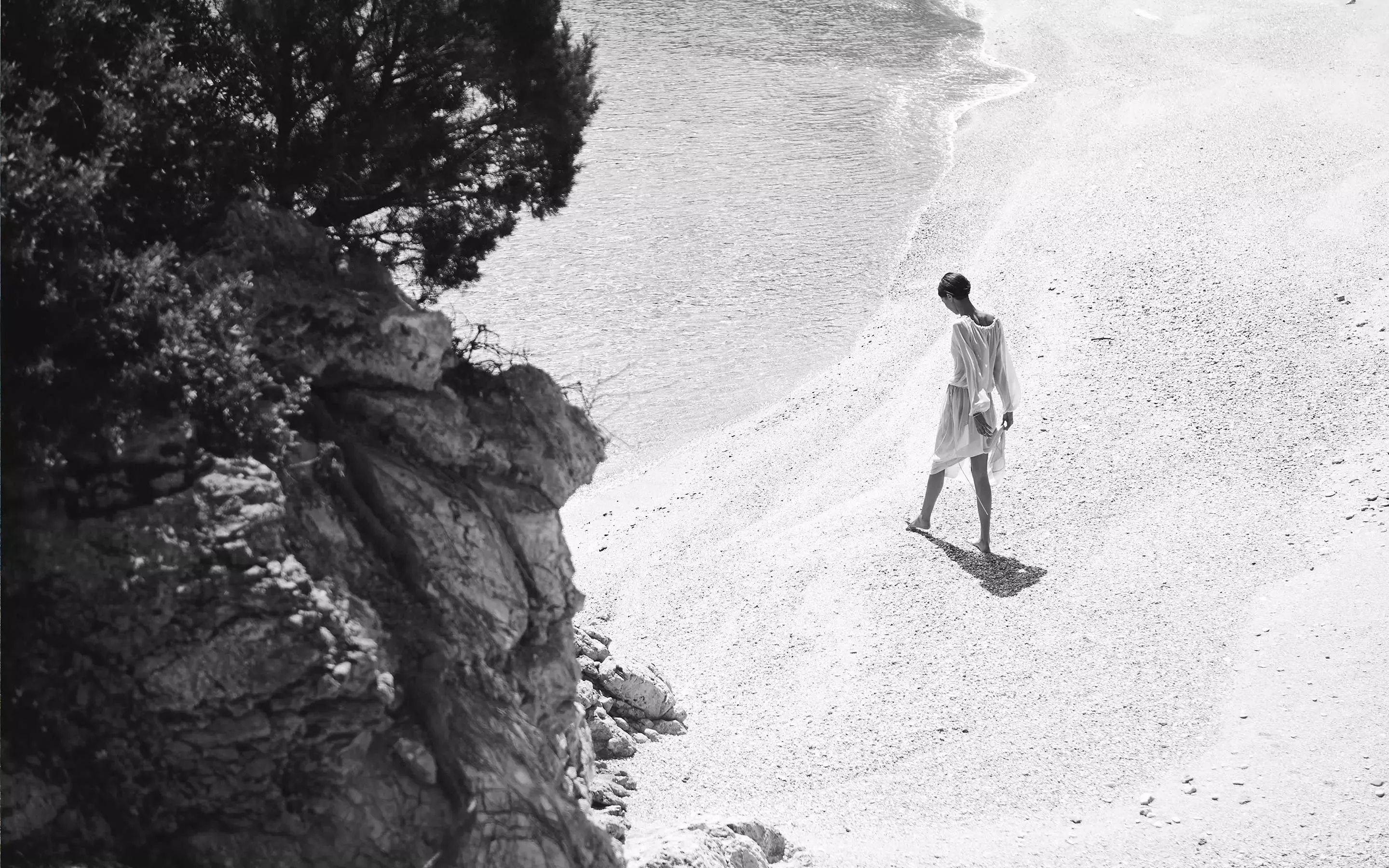 Woman Walking On The Beach At One&Only Aesthesis