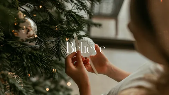 Child holding Christmas bauble
