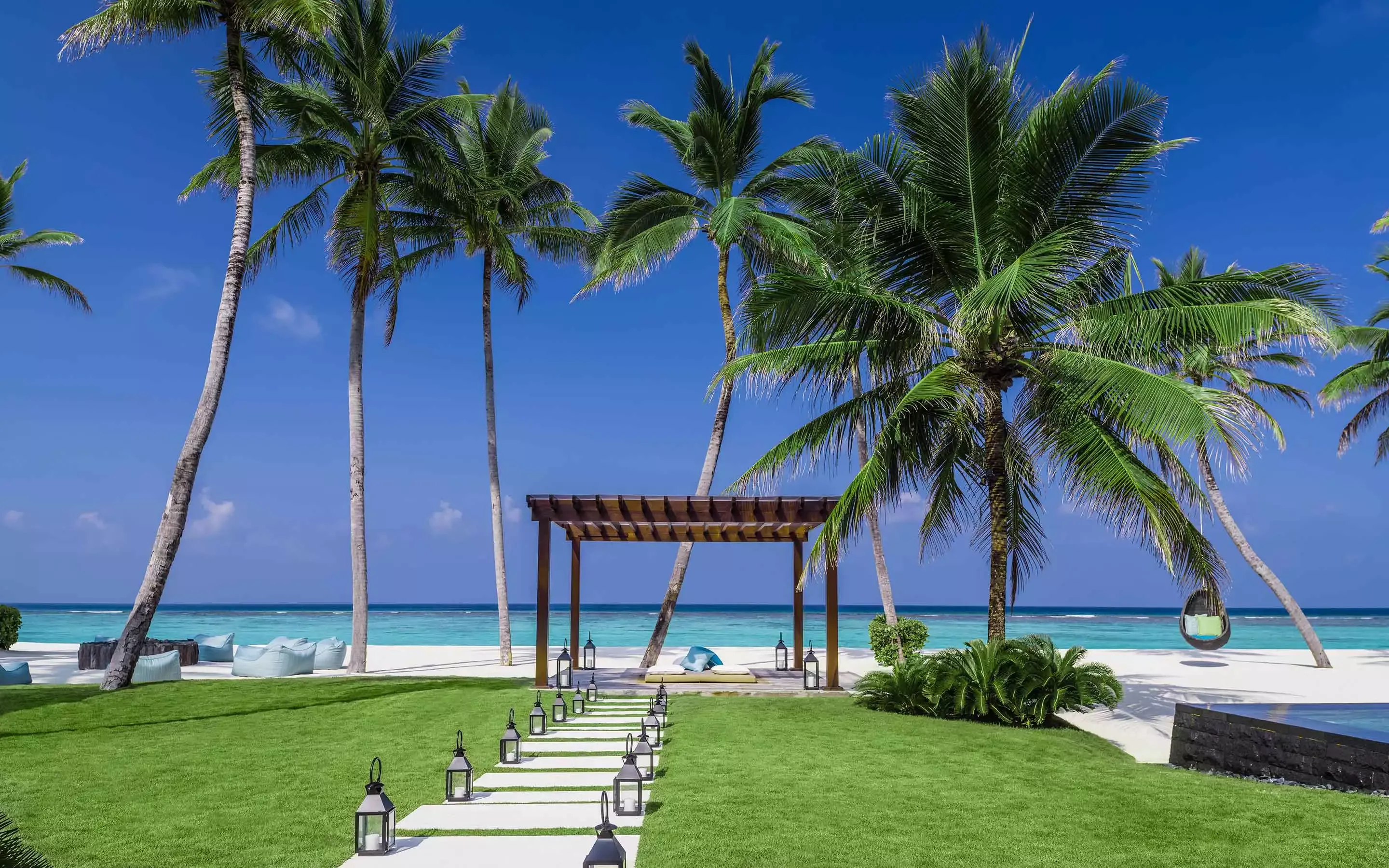 Seating setup at the beach at One&Only Reethi Rah