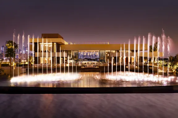 Milos restaurant with fountain at night