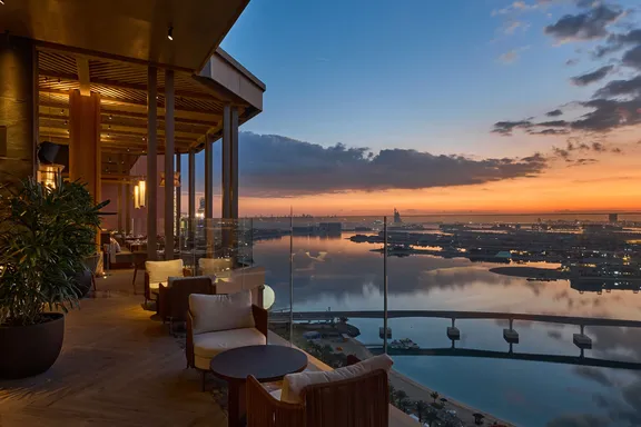 Nobu by Chef Nobuyuki Matsuhisa terrace seating overlooking The Palm at sunset in Atlantis, The Palm