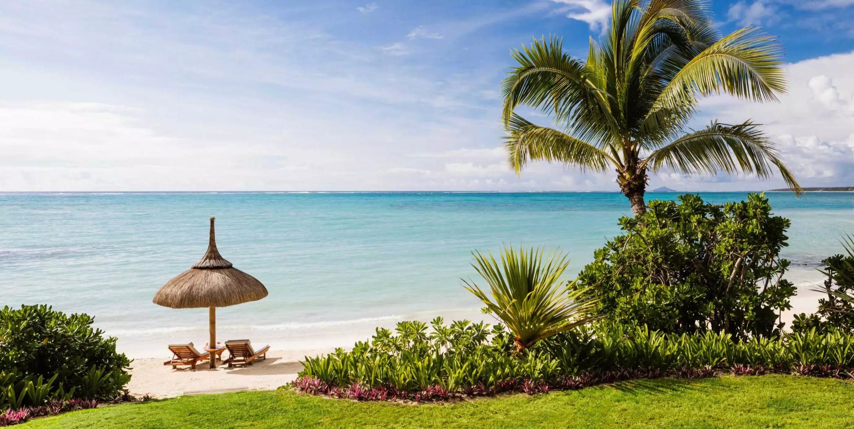 View of the Greenery and sunbeds on the beach at One&Only Le Saint Géran