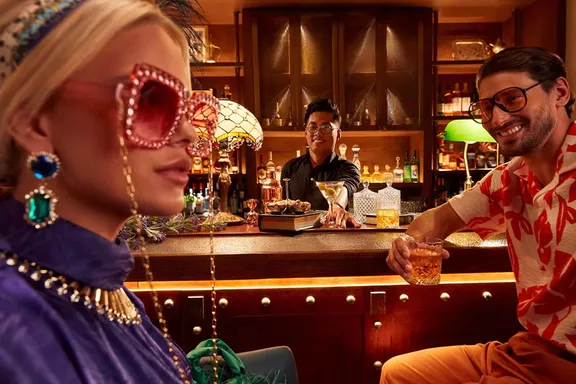 Stylish couple savoring their beverages at Ya Hala, Bab Al Shams