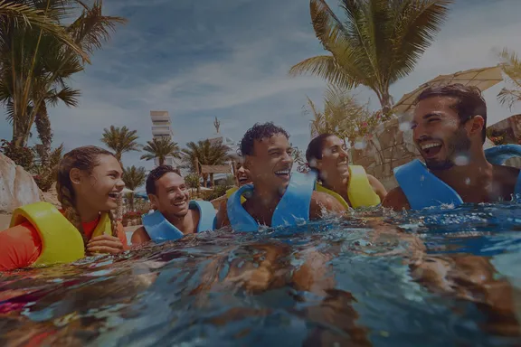Group of Friends at Aquaventure River Rapids with Dark Overlay 