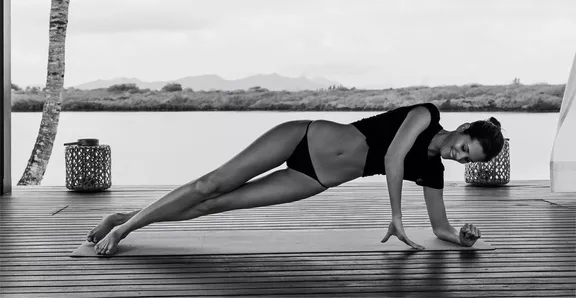 Woman Practicing Yoga at One&Only Le Saint Géran