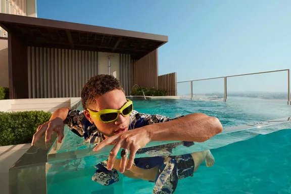 Man Swimming in Skypool Villa at Atlantis The Royal
