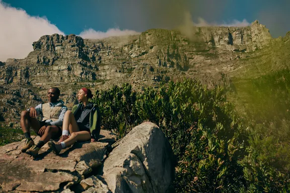 Couple enjoying the view while hiking Table Mountain 