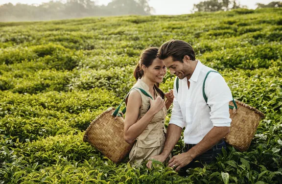 Couple picking tea plants at One&Only Nyungwe House