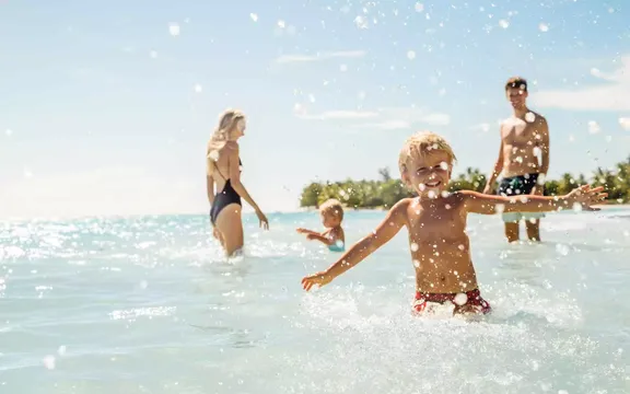 Family enjoying the water at One&Only Le Saint Géran