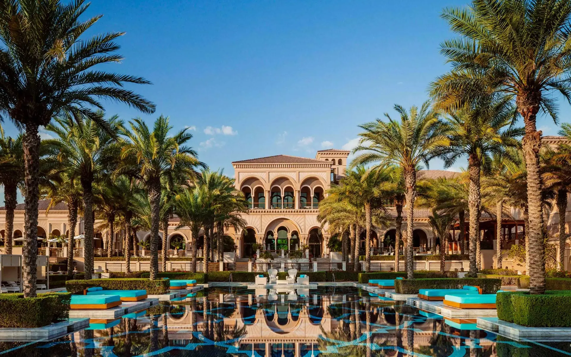 One and Only Royal Mirage Dubai Grand Pool with palm-shaded daybeds and private cabanas
