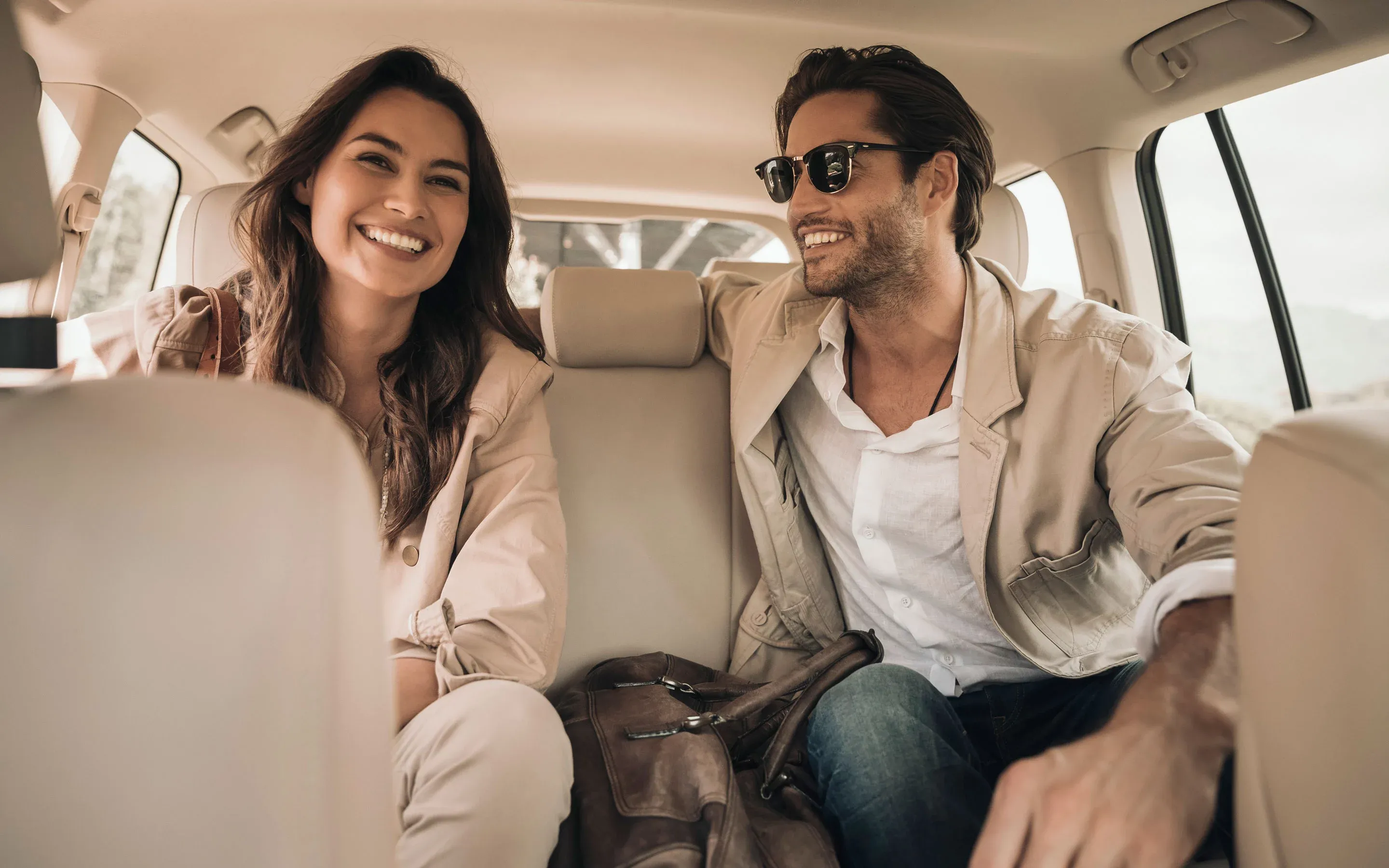 Couple Arriving in a Car to One&Only Resorts