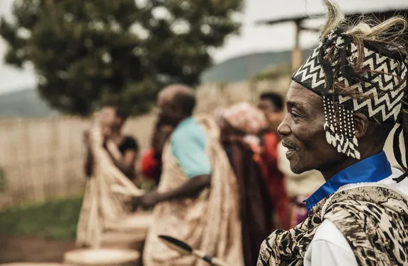 A man standing with a group of people at One&Only Nyungwe House