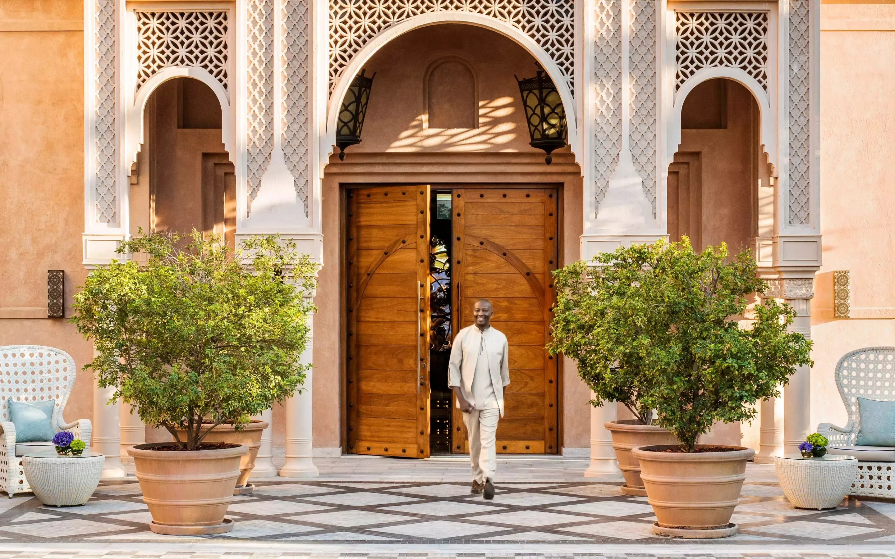 Man standing at the main entrance of One&Only The Palm Dubai