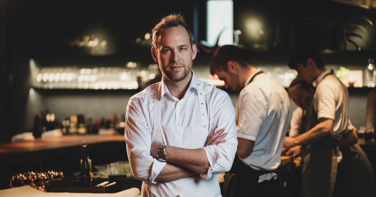 Acclaimed chef Björn Frantzén stands in front of his team. Image credit: Atlantis Dubai/FZN by Björn Frantzén