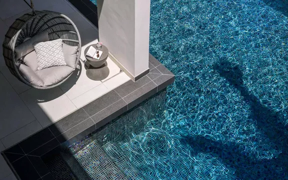 View of swing chair by the pool at One&Only Le Saint Géran