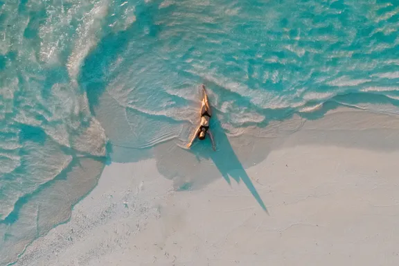 Girl in Swimsuit Relaxing on the Beach