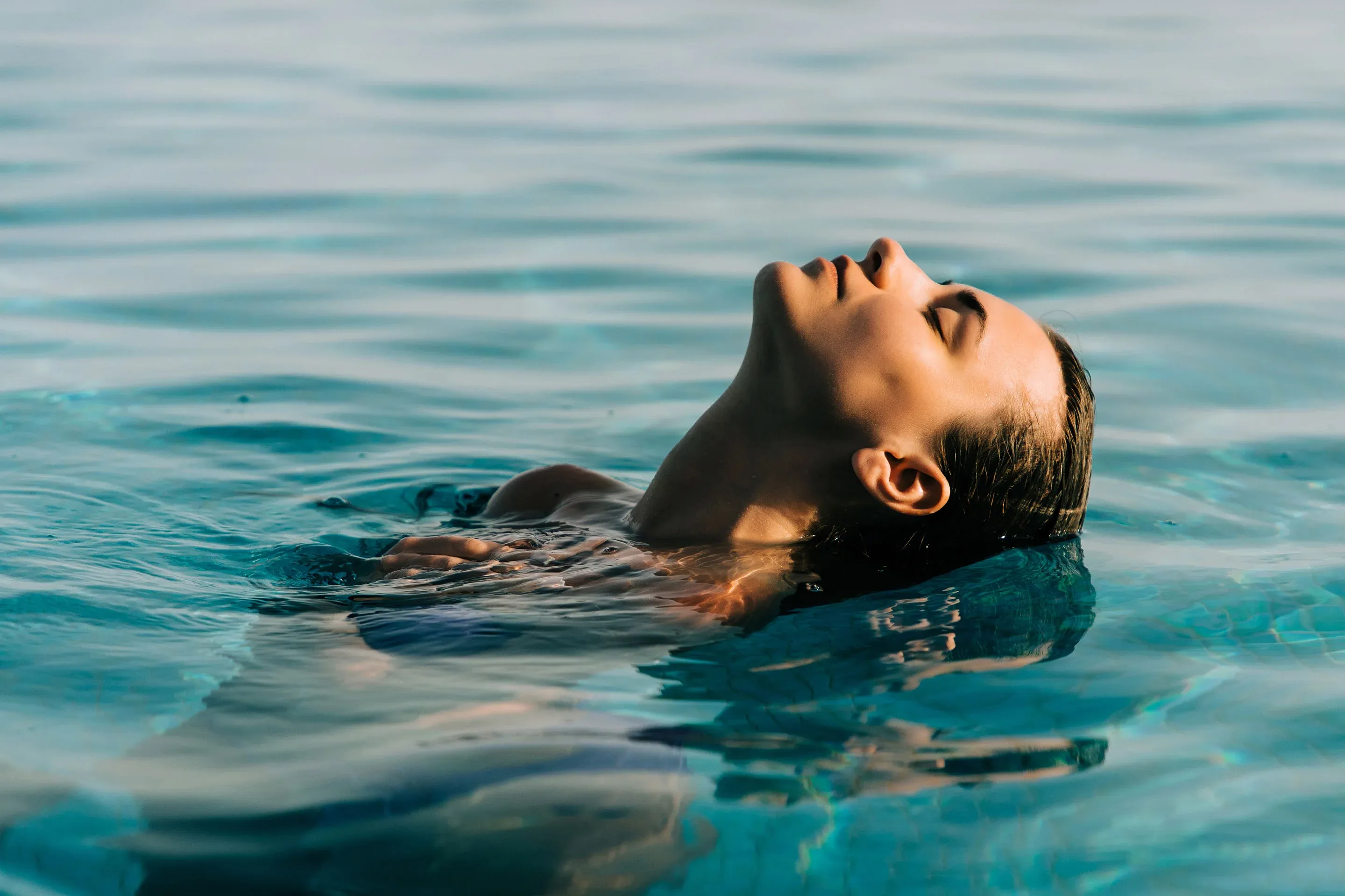 Girl Relaxing in the Pool at AWAKEN