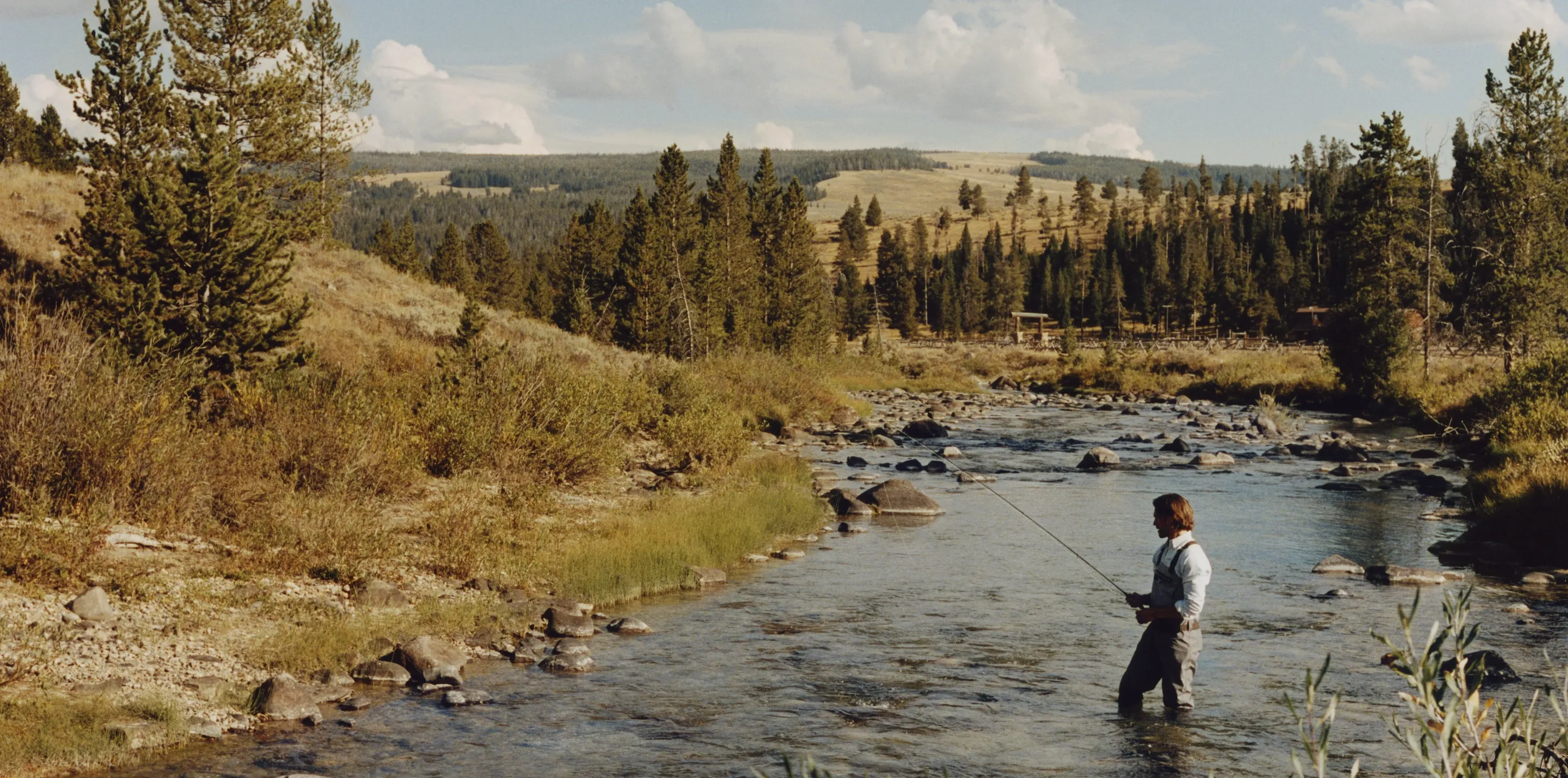 Man fishing by the lake at One&Only Moonlight Basin