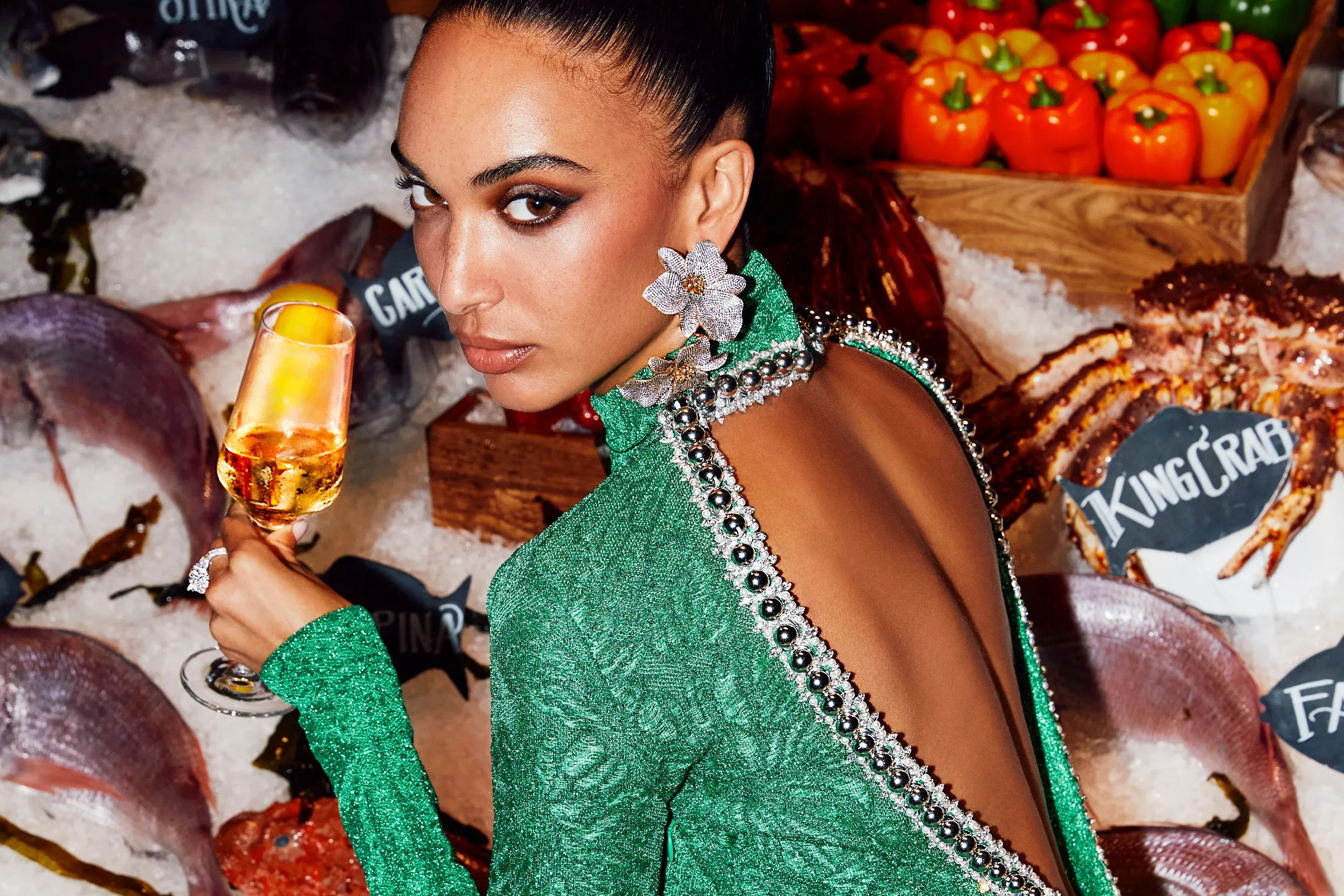 Girl Holding Champagne by the Fish Bar at Milos in Atlantis the Royal