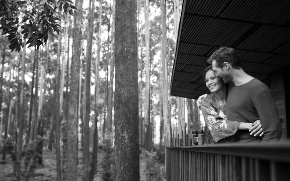 A couple relishing their time at the Luxury Susa Treehouse at One&Only Gorilla's Nest