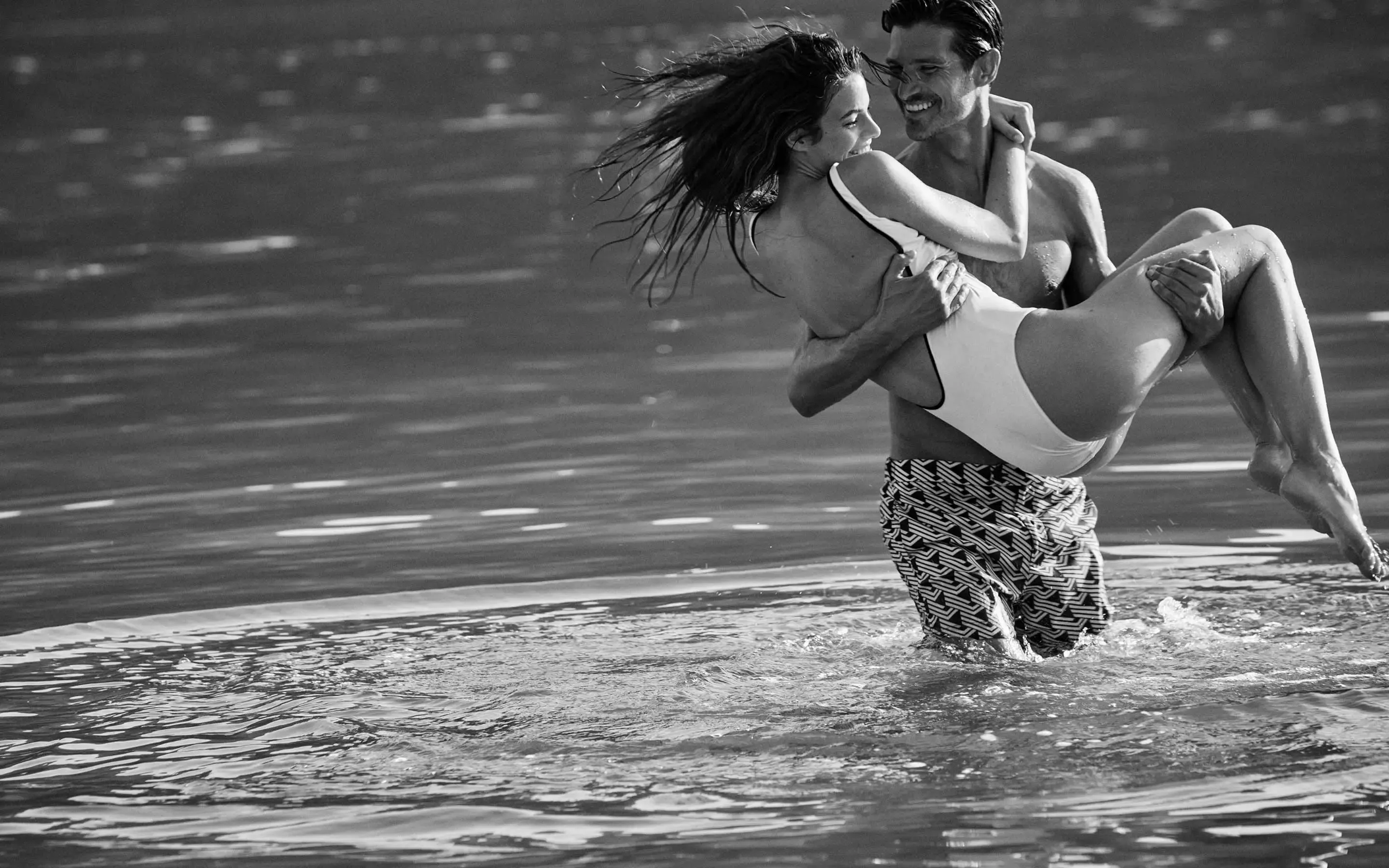 A couple enjoying themselves in water at One&Only Portonovi