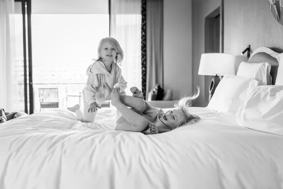 Children playing on Marina Suite bed 