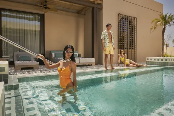 People enjoying at poolside at Bab Al Shams