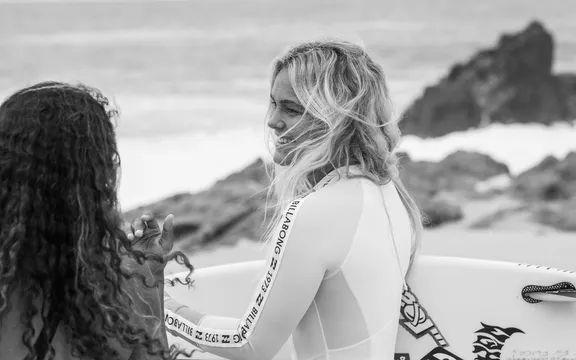 Women holding the surfboard at One&Only Palmilla 