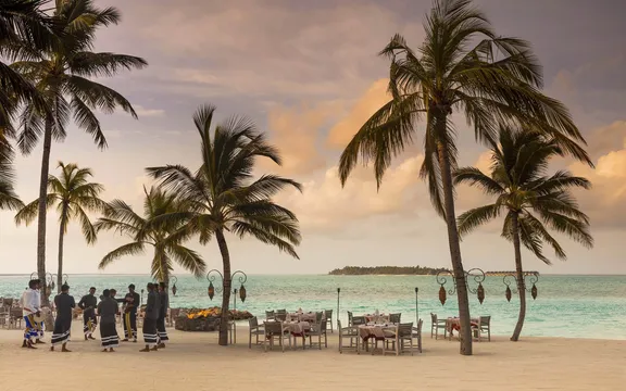 Staff Dancing Around the Firepit at Fanditha Restaurant at One&Only Reethi Rah