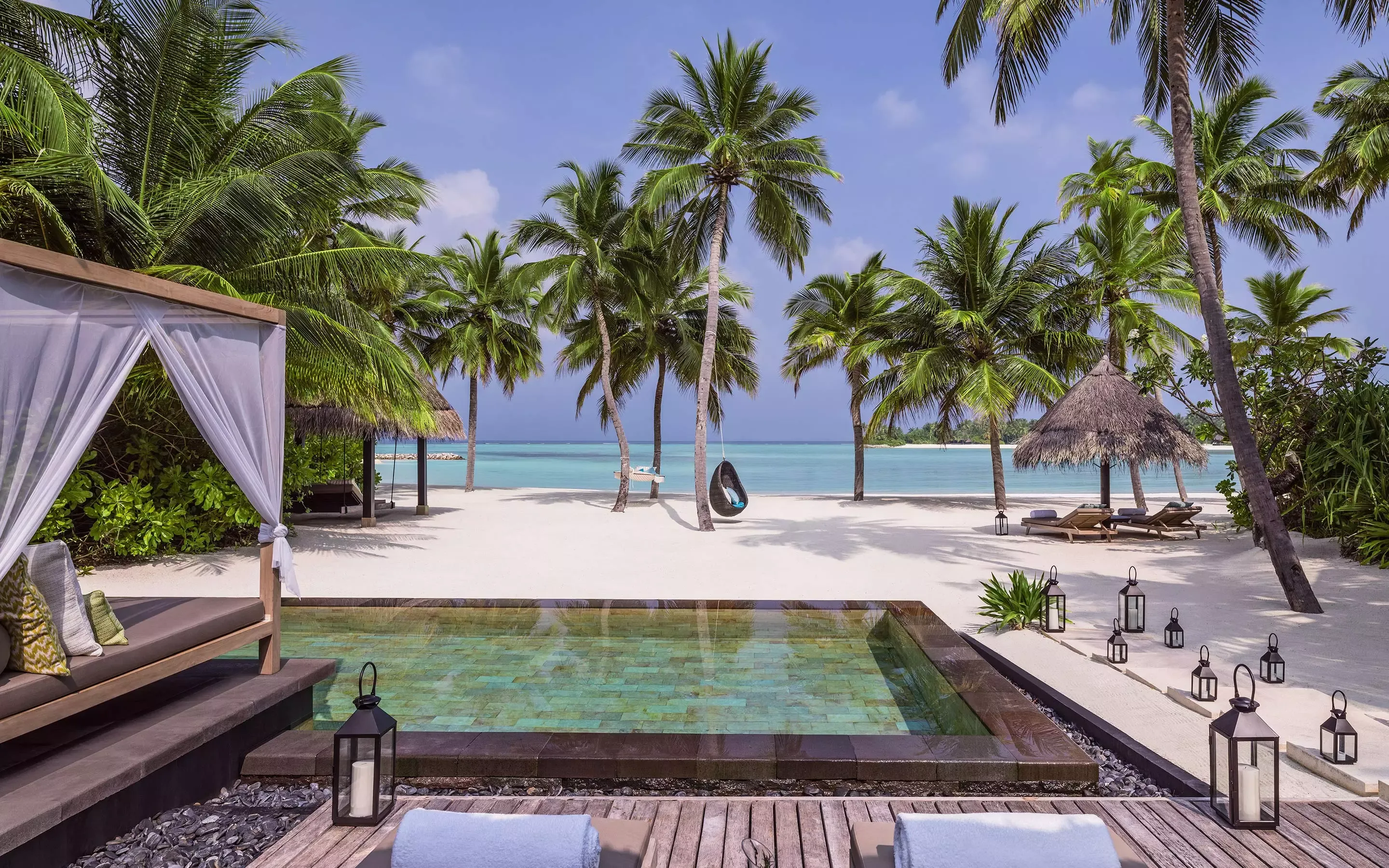 Exterior view of a beach villa at One&Only Reethi Rah