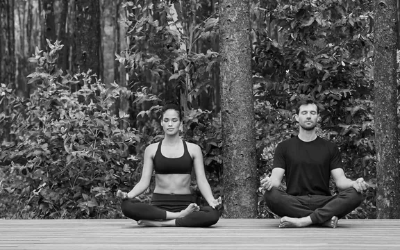 Couple Doing Yoga | One&Only Gorilla's Nest
