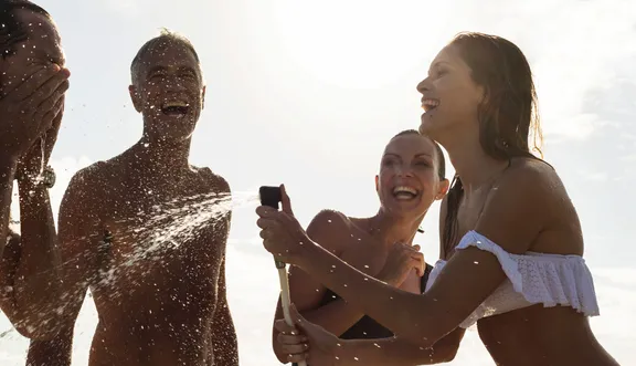 Family enjoying a bath together under the warm sun